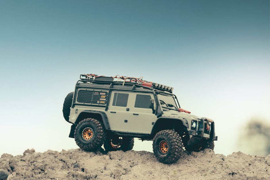 Image of a vehicle traversing over rough terrain with increased ground clearance